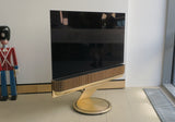 BeoVision Theatre 55<br>4K HDR OLED Smart-TV <br>gold tone / light oak (2022)